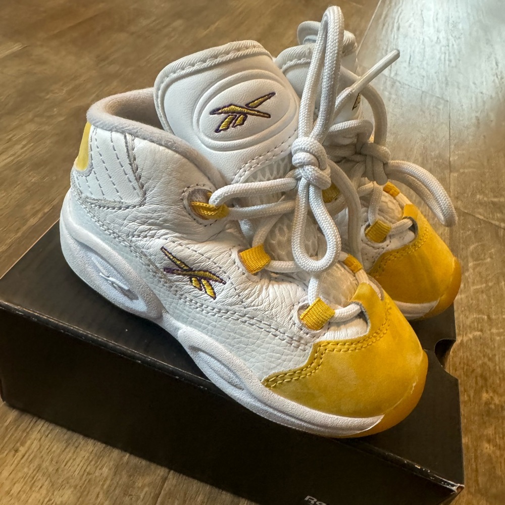 Reebok question mid toddlers in the color yellow and white size 7C.